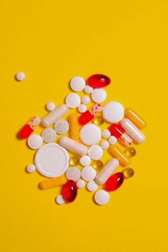 yellow-surface-and-supplement-capsule-3683099